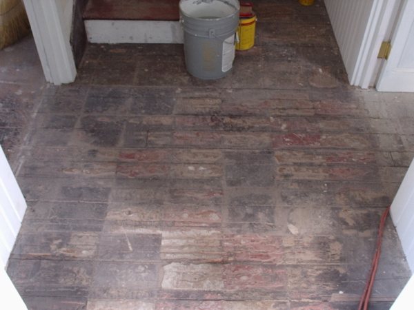 Original brick hearth uncovered during demolition.